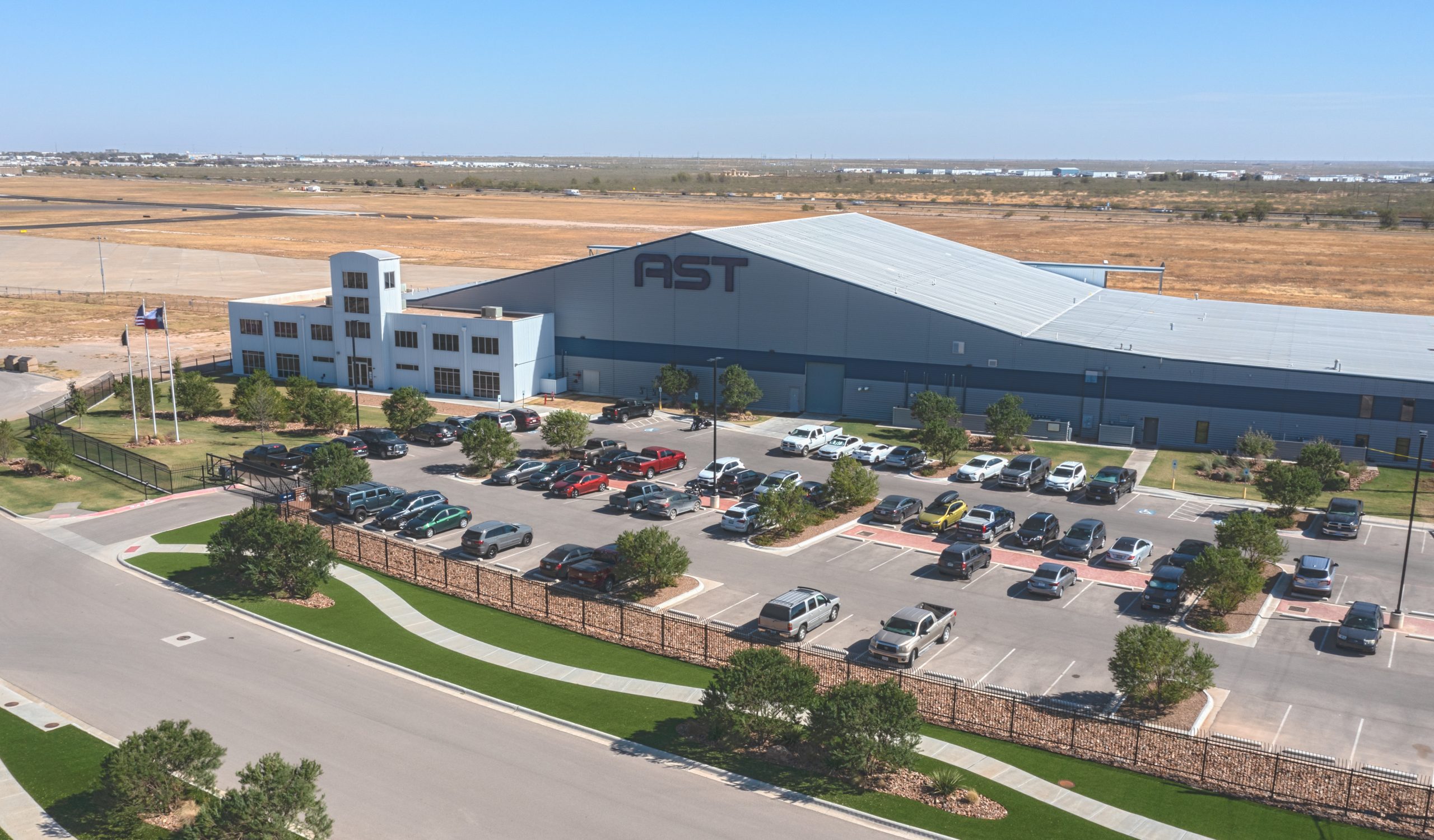 ast spacemobile headquarters hangar building with ast logo from aerial view-ASTS