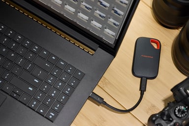 Sandisk product next to a computer
