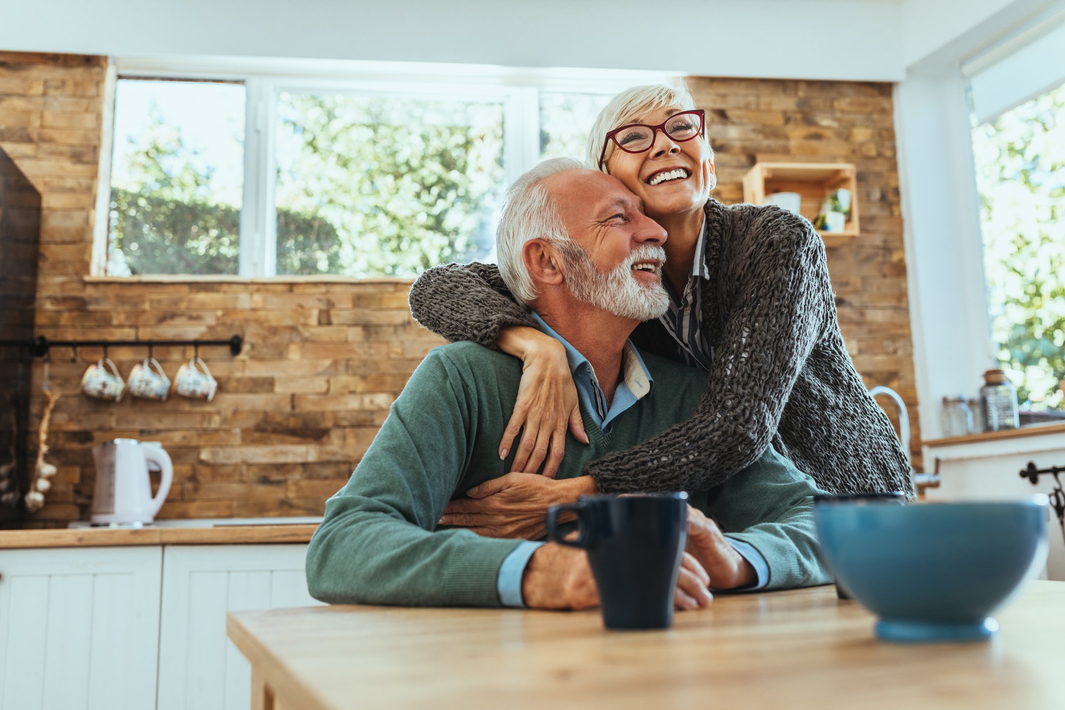 Senior couple happy embracing GettyImages-1125719715