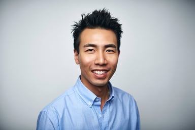 Getty - happy person in blue oxford shirt slight smiling