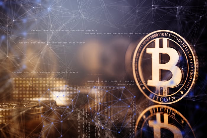 A gold coin with the famous Bitcoin B on it.
