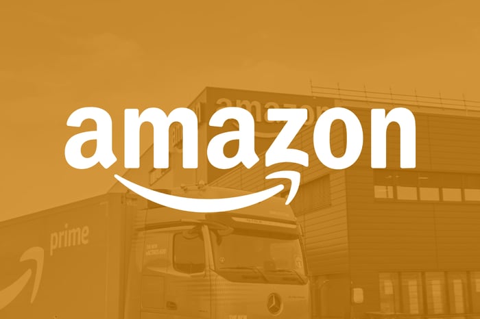 An Amazon logo in front of an Amazon logistics center.
