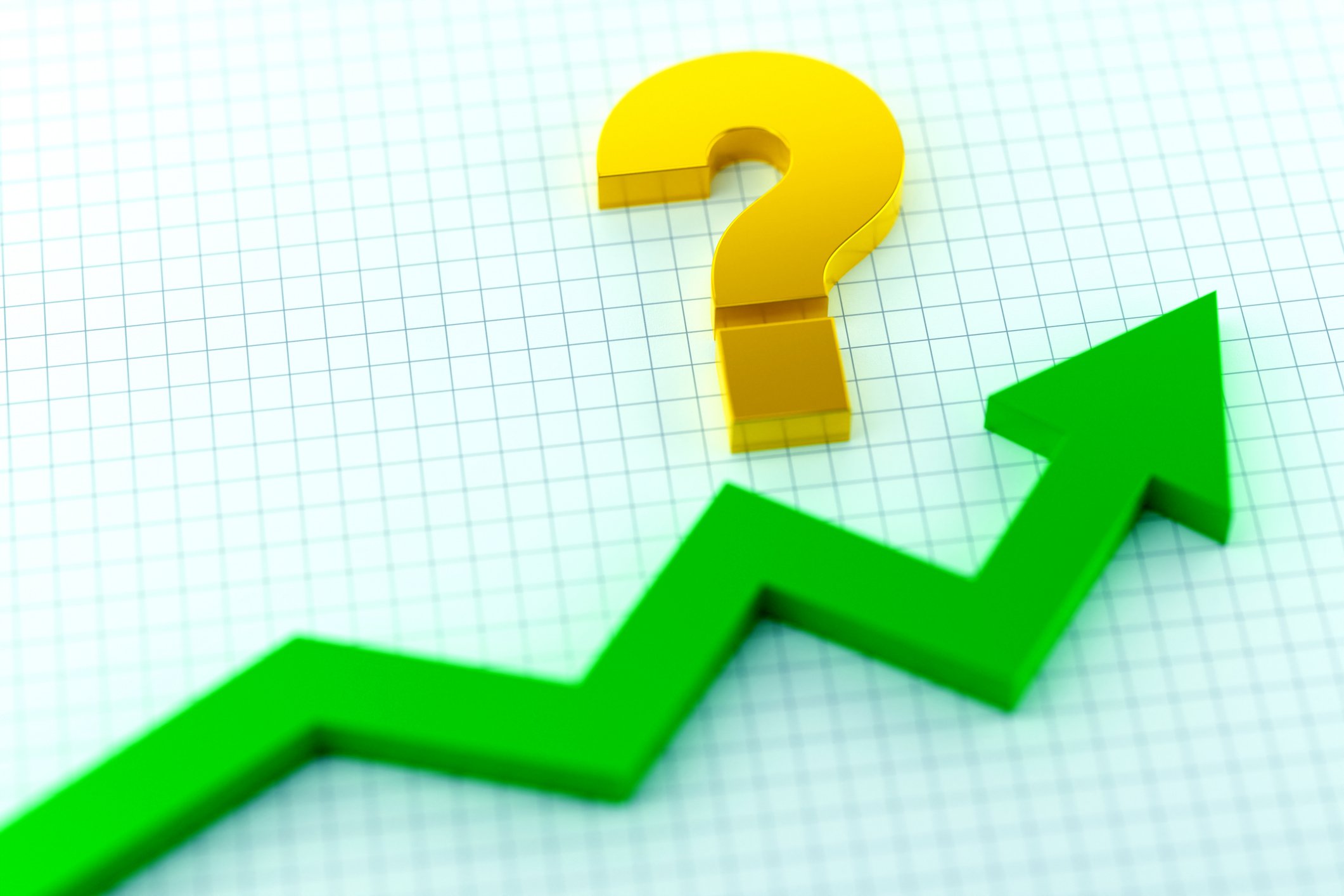 Gold question mark over a rising green stock market arrow laid out on graph paper.