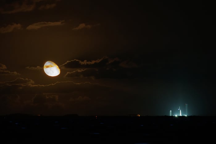 space shuttle taking off at night
