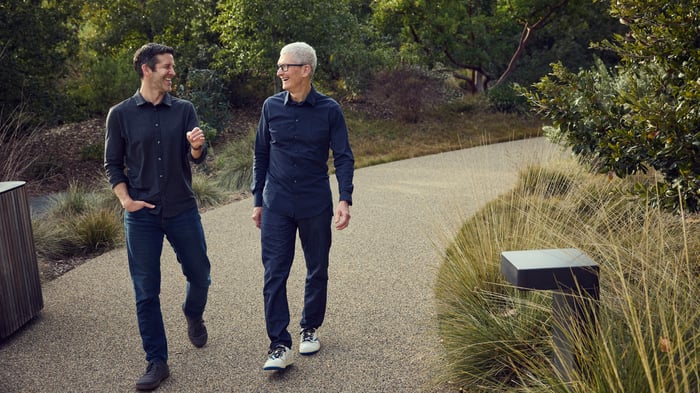 New Apple CEO John Ternus walking next to outgoing Apple CEO Tim Cook.