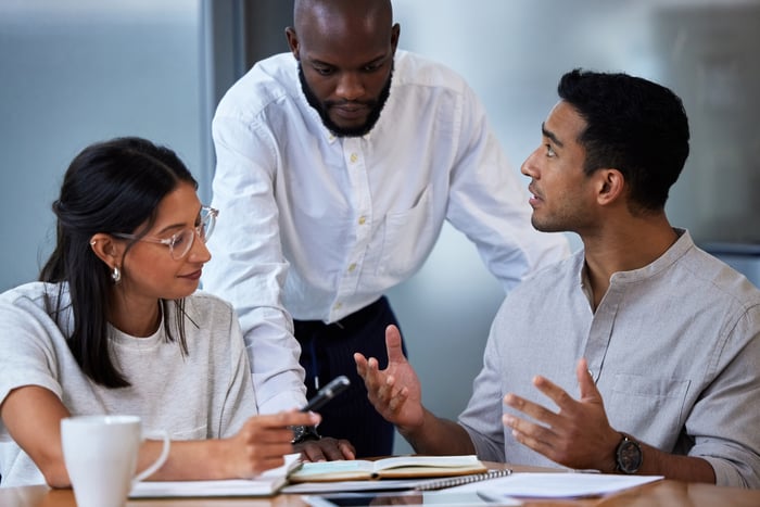 workers collaborate during a business meeting