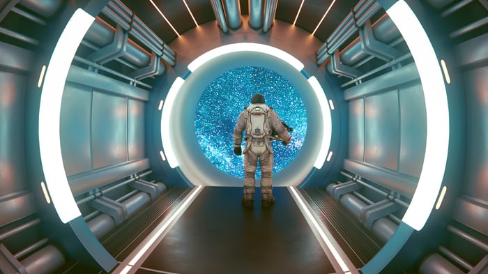 Astronaut standing in a spaceship.