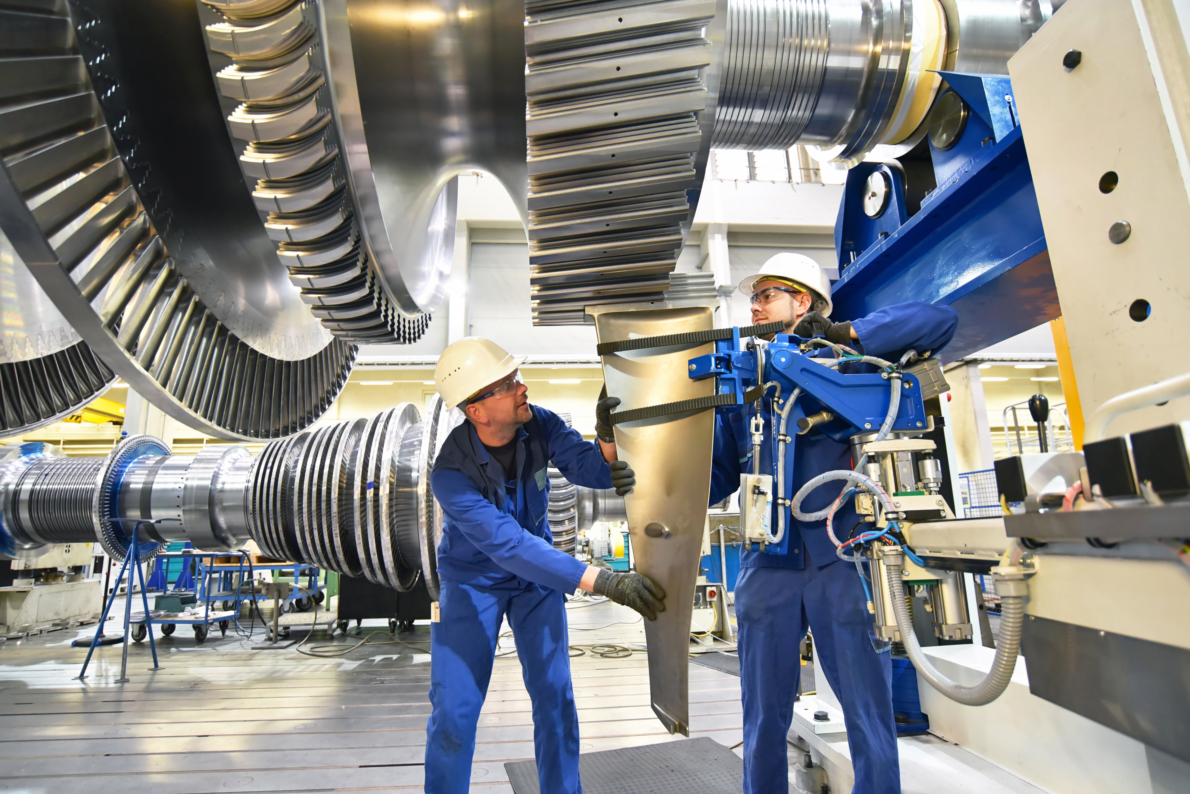 engineers working on airplane engine