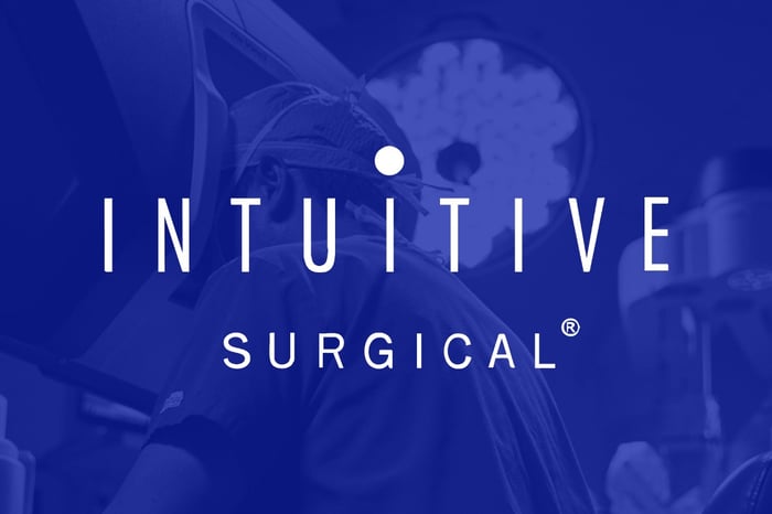 The Intuitive Surgical logo is shown against a dark blue background.