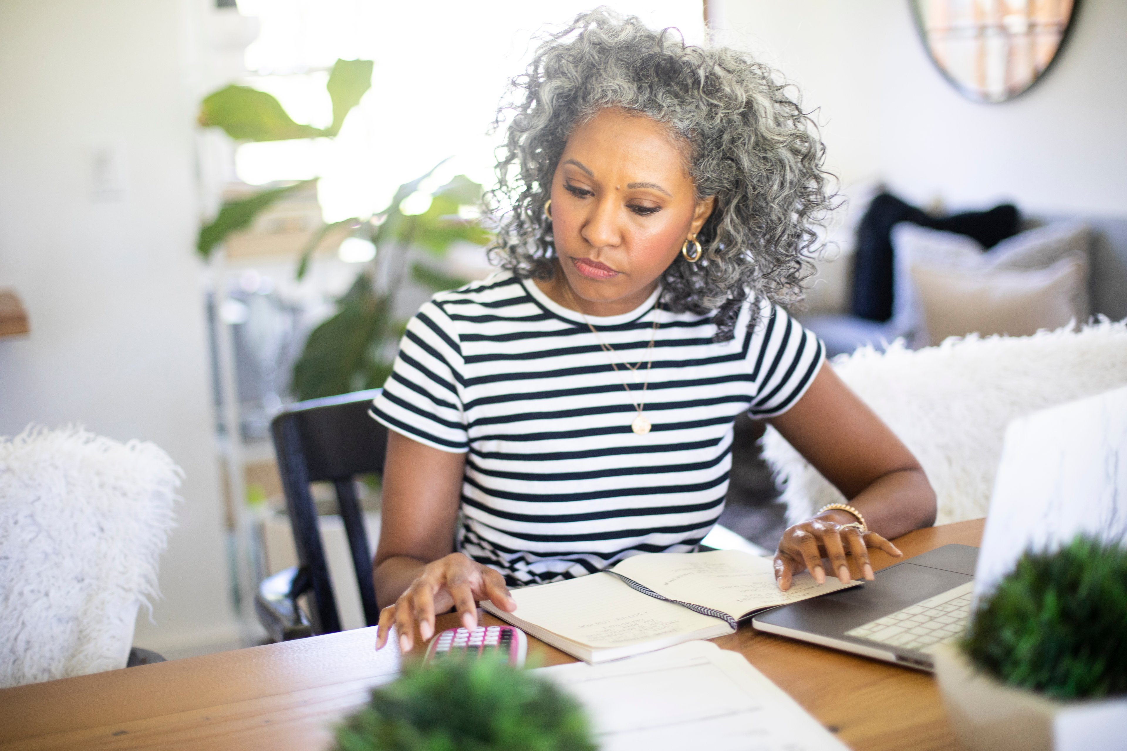 retired woman financial planning budgeting calculator