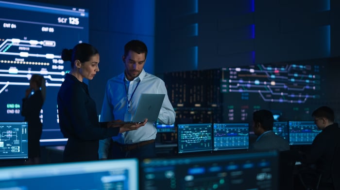 People are working in an AI data center. 