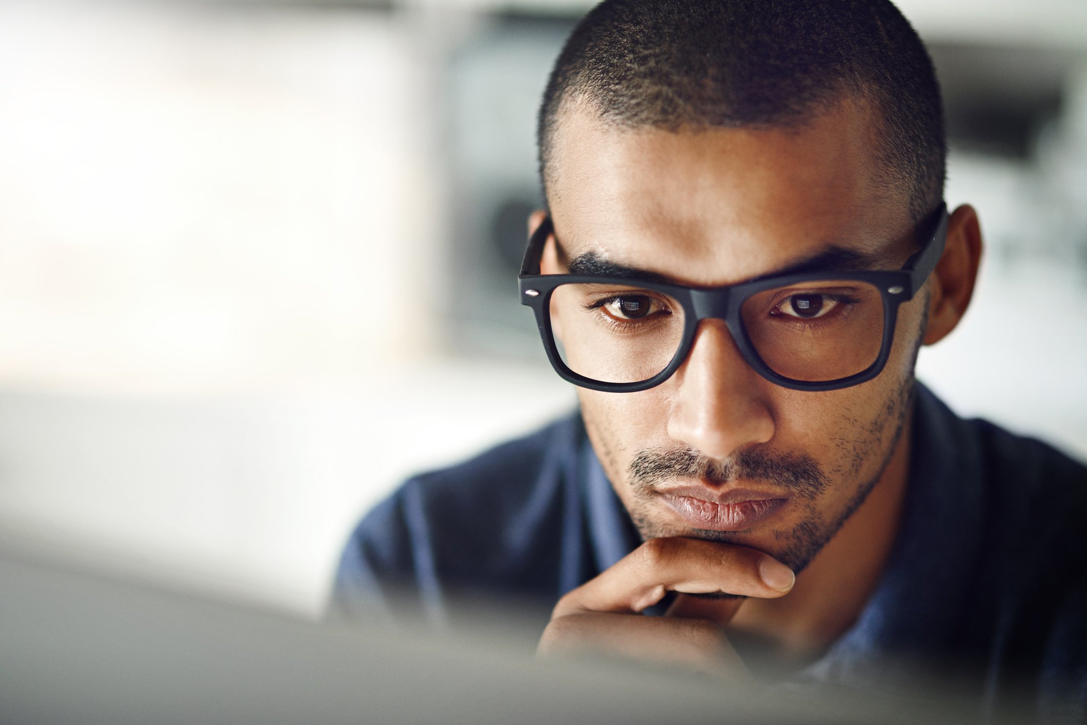 investor ponders a screen