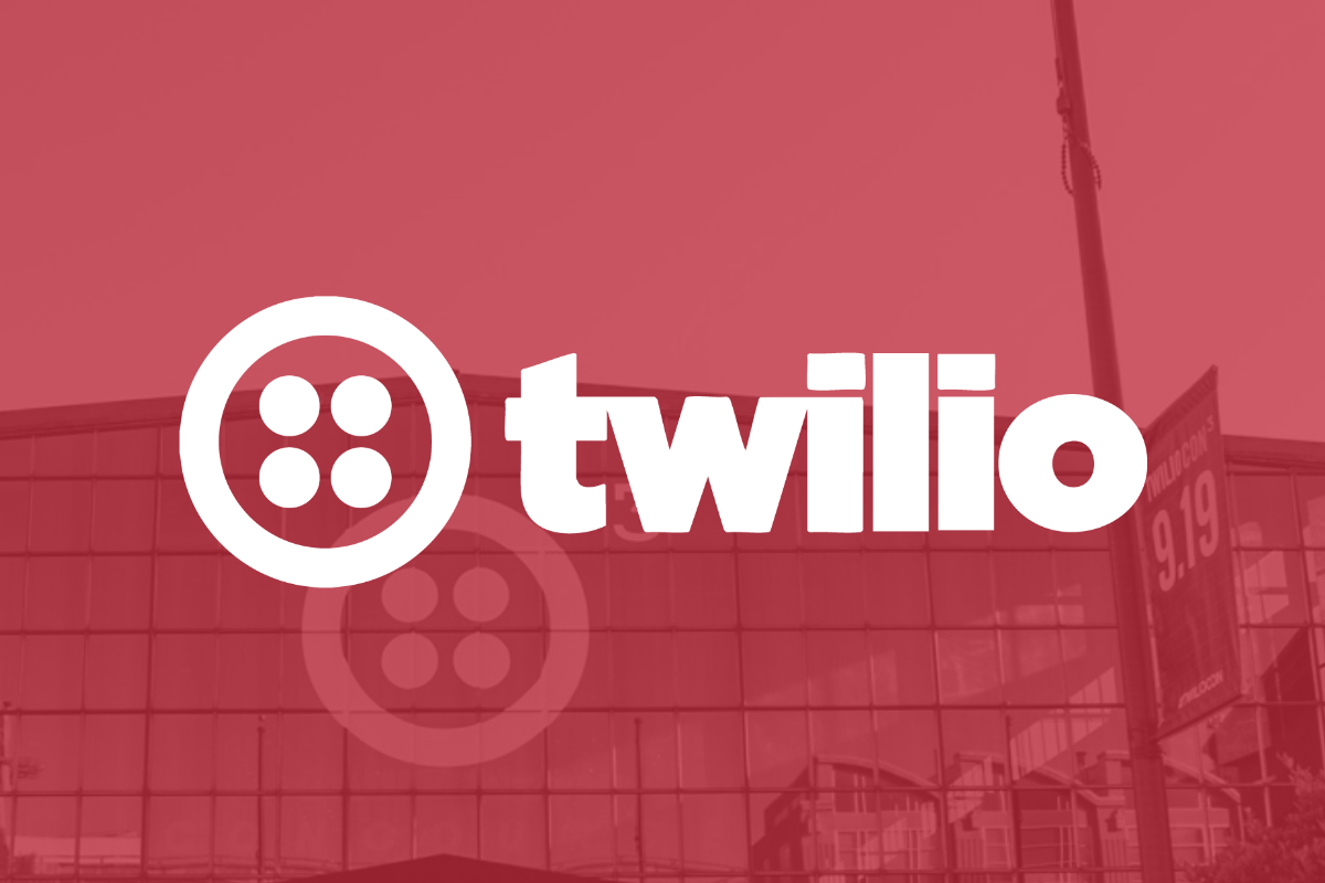 The Twilio logo superimposed over a picture of the company's headquarters building.