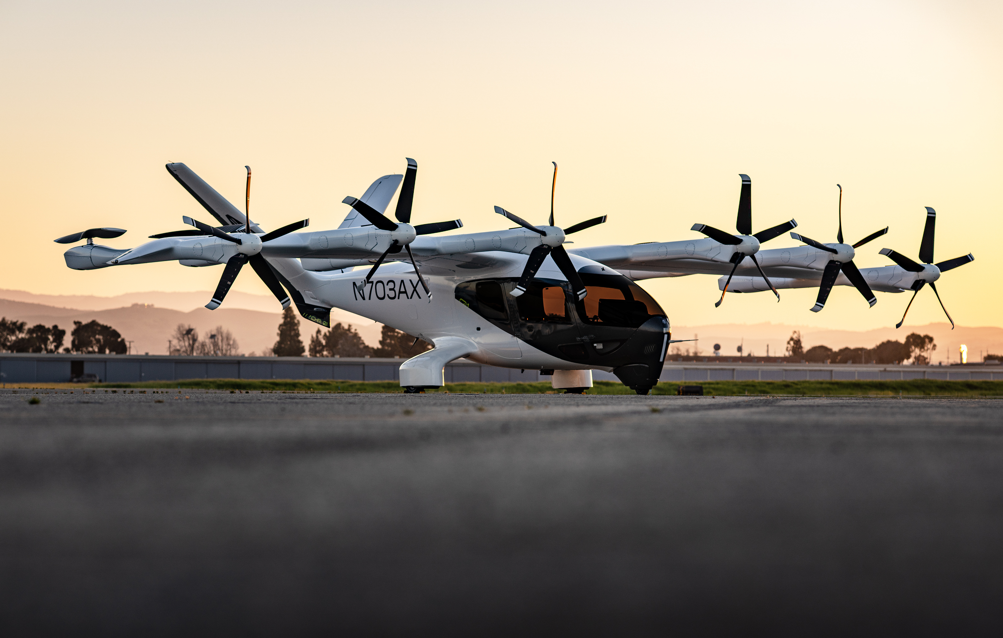 archer aviation evtol aircraft on tarmac at sunset N703AX-ACHR
