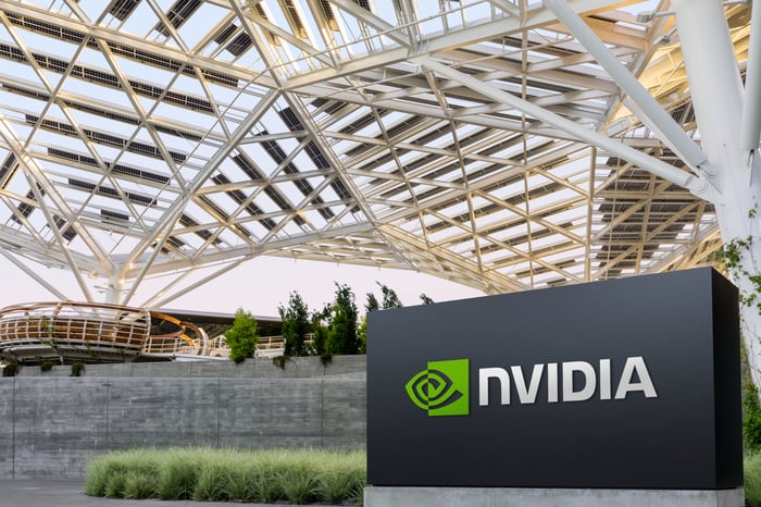 Nvidia headquarters with company logo on a black block in the foreground.