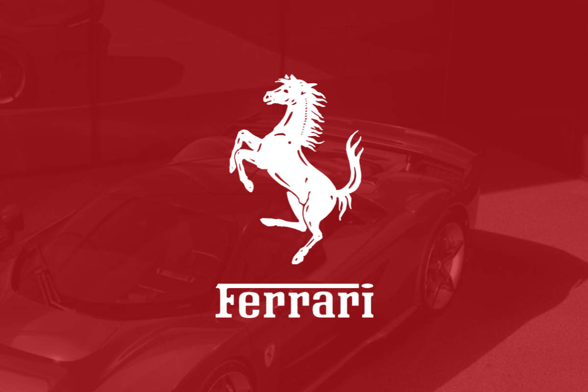 Ferrari logo on red filter with Ferrari car in background_The Motley Fool