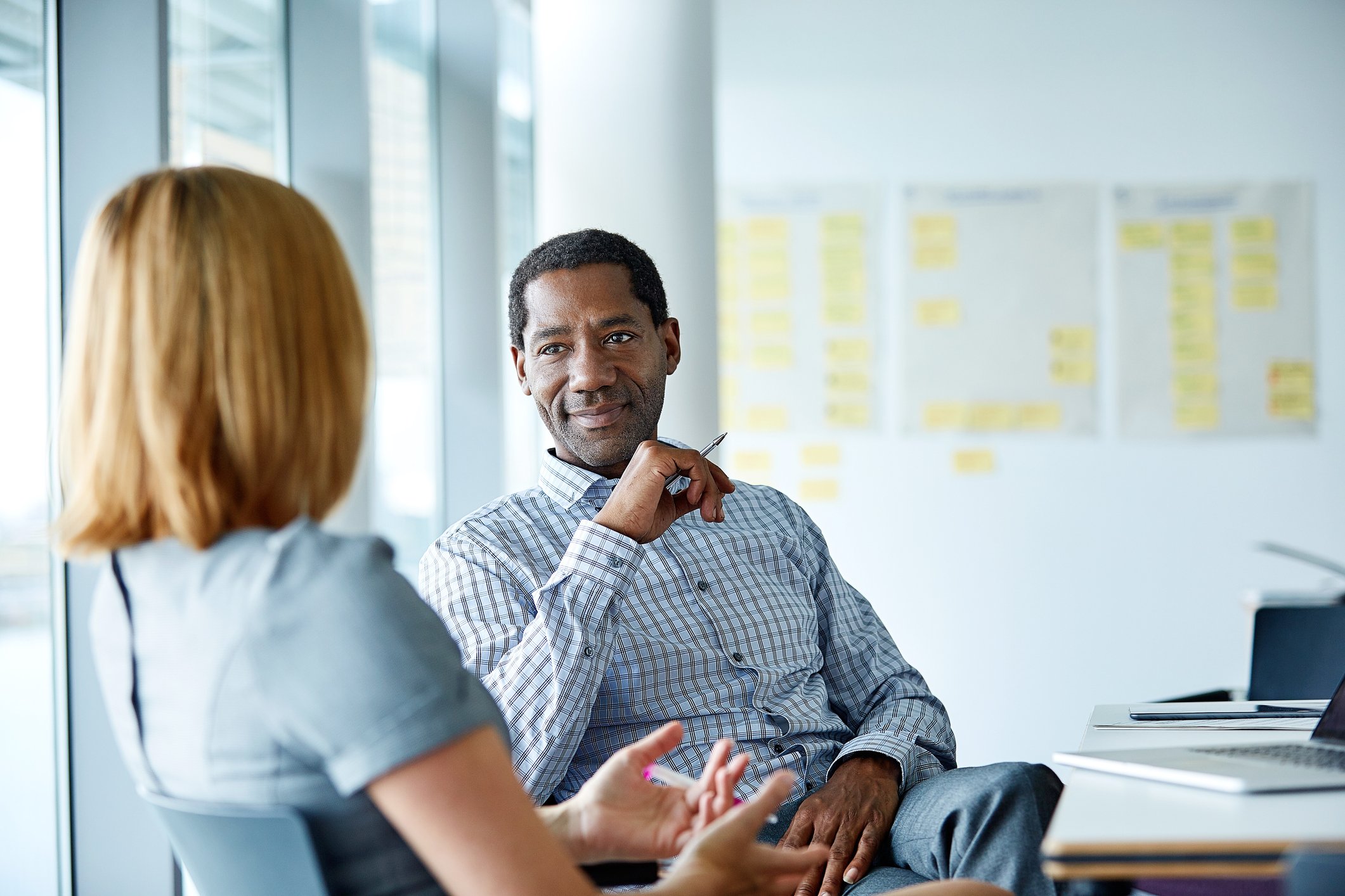 Two_colleagues_discussing_in_office