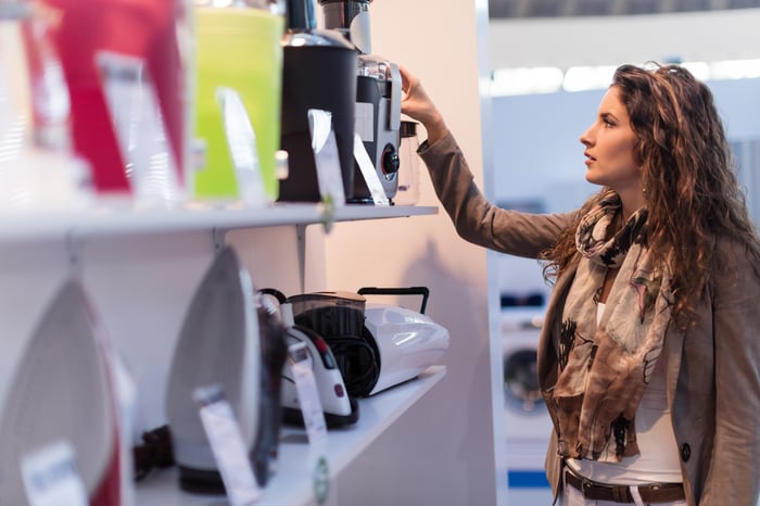 Someone looking at an item in a store.