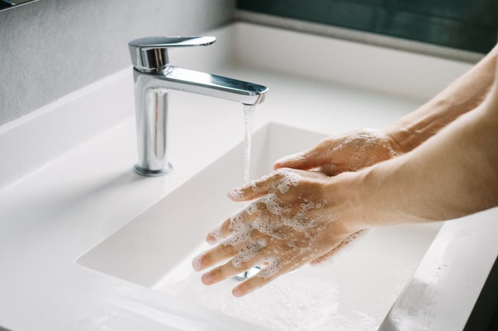 Someone washing their hands.
