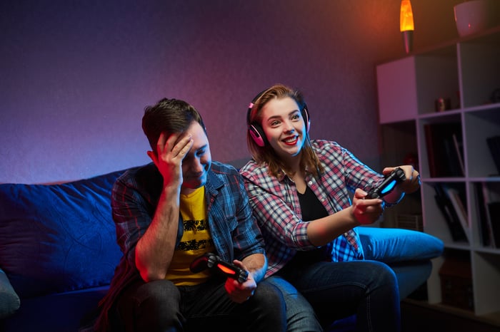 Two people are playing video games. 