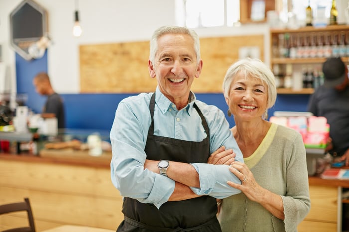 Two smiling people.