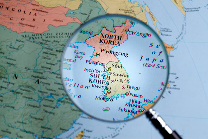 Map of Korea under a magnifying glass.