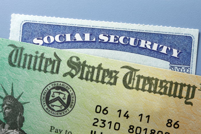 Social Security check and card.