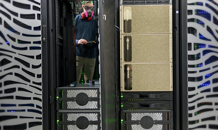 Person inside a data center equipped with Nvidia chips.