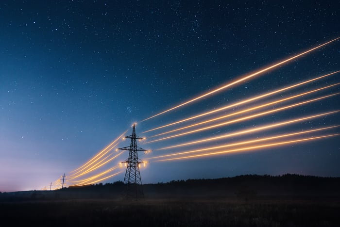 Lit up power lines between towers.