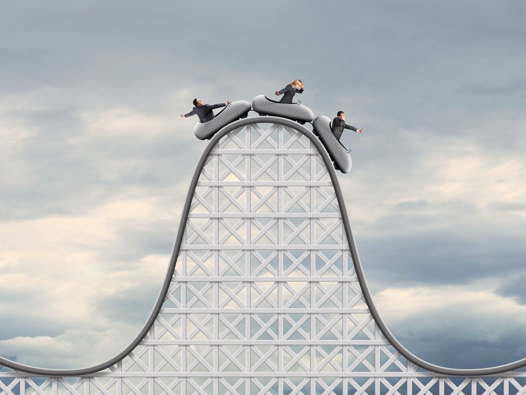 26_07_31 Three people on a rollercoaster ride cresting a peak _GettyImages-1473821519-1066x800-82d3b79