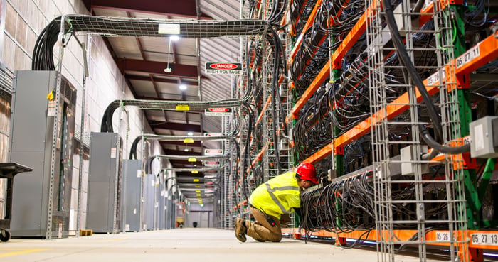 A data center electrician is installing an 800-volt power supply.