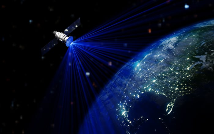 A rocket flying into the space, leaving Earth.