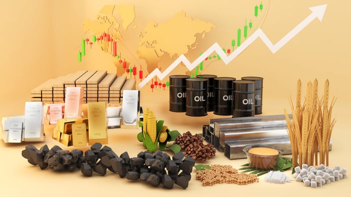 A bunch of commodities with a stock chart rising.