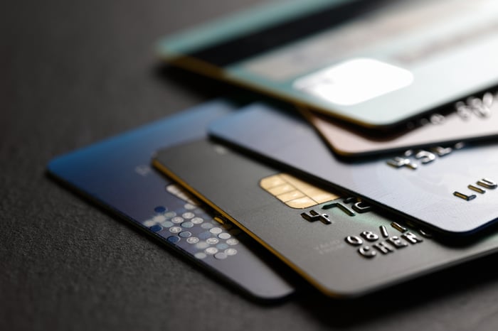 An array of different credit cards on top of each other.