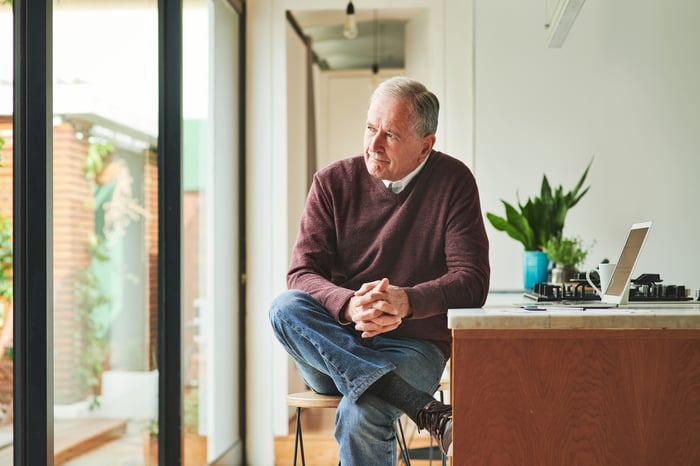 A person sitting near a window.