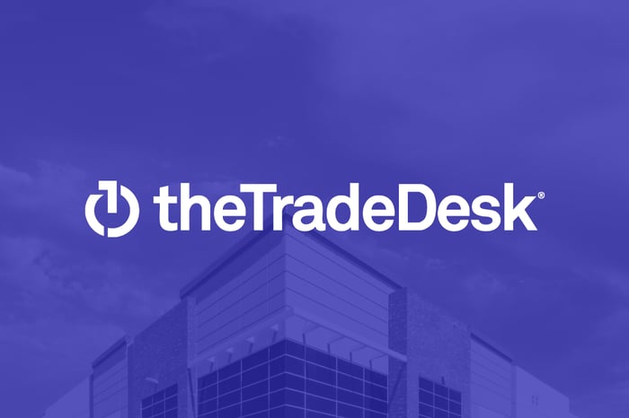 White The Trade Desk logo on a purple background.