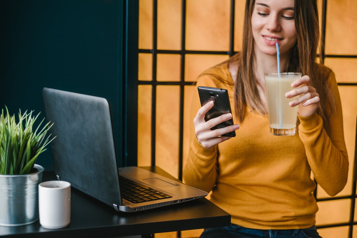 woman drinking lemonade on phone-1201x800-5b2df79