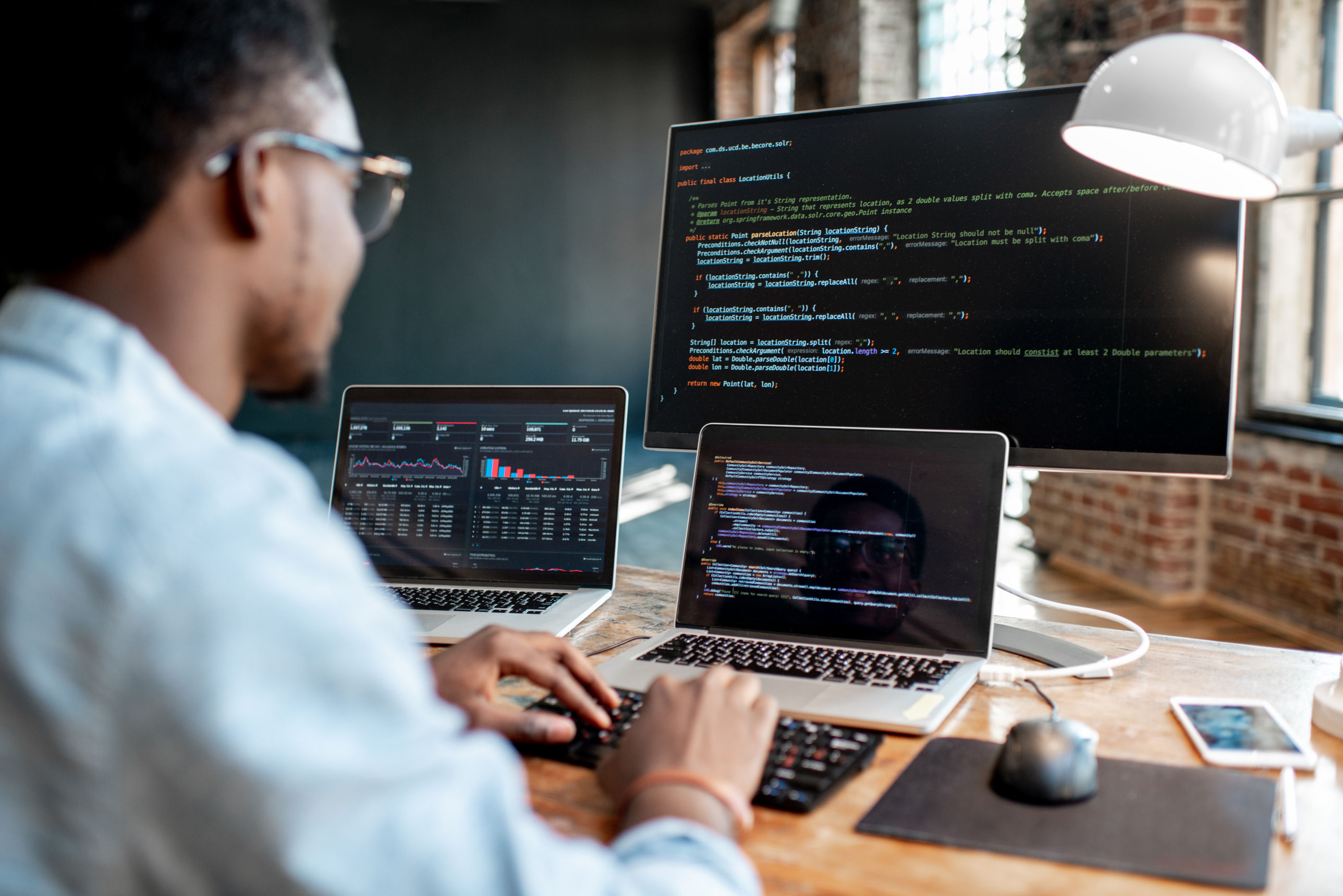 software programmer coding a program