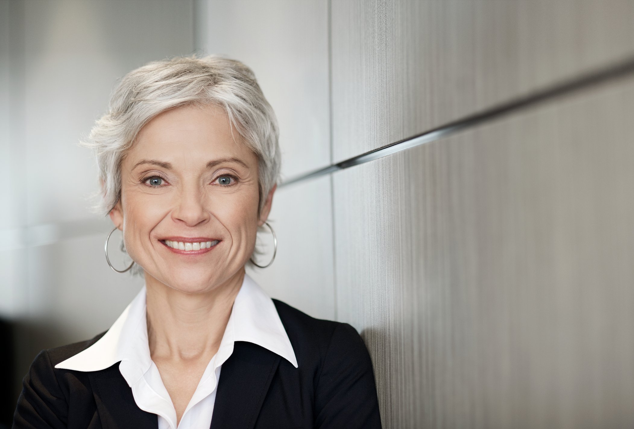 Woman older gray hair suit GettyImages-109721958