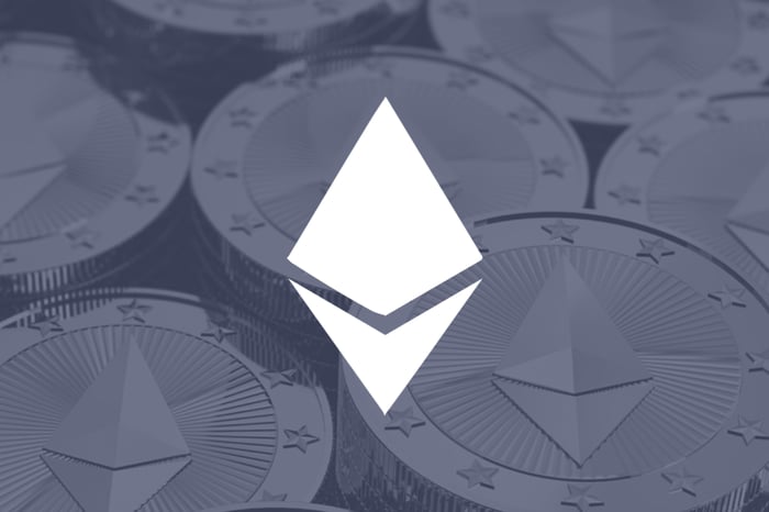 White Ethereum logo on a gray background.