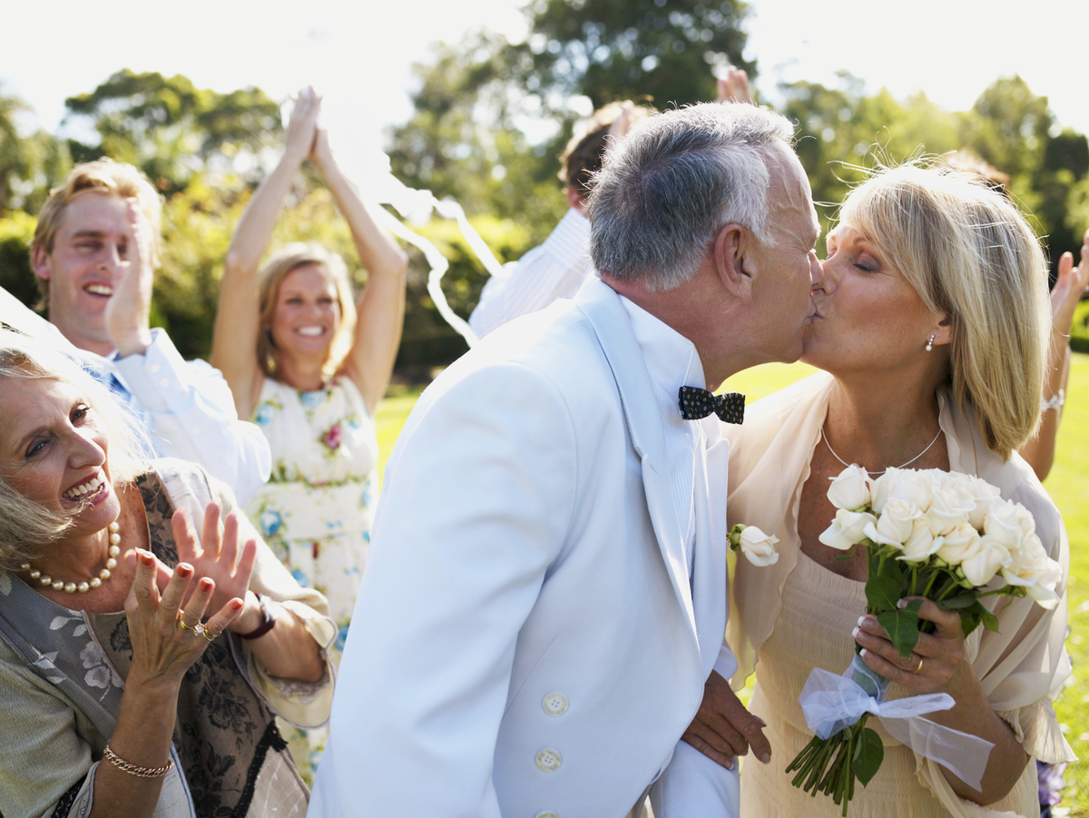 mature couple getting married kiss with bouquet-1201x901-1c7b5e7