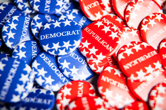 Blue buttons that say Democrat and red buttons that say Republican.
