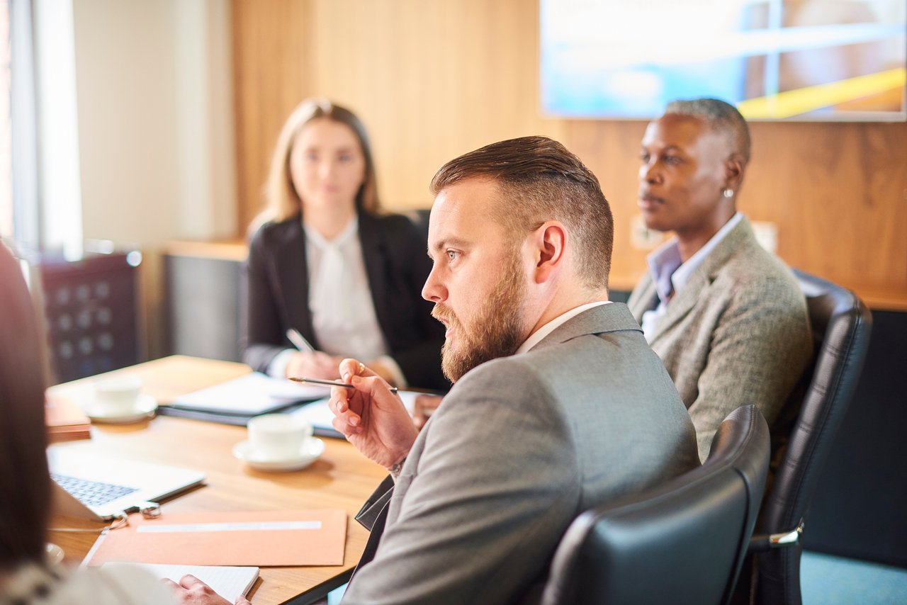 people at a business meeting in a conference room.