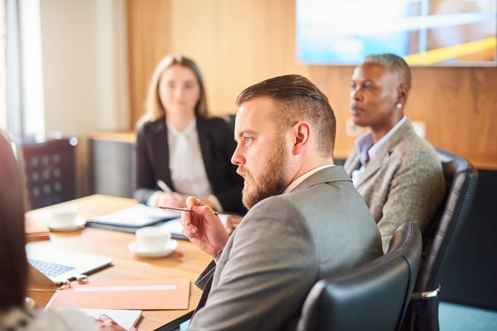 people at a business meeting in a conference room.