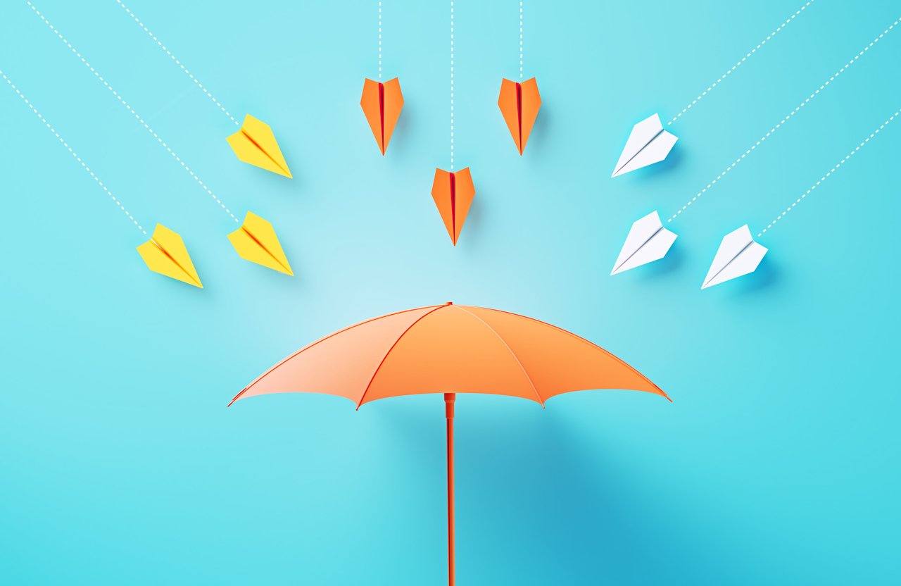 26_10_21 An umbrella with paper airplanes flying at it _MF Dload GettyImages-2136187857-1280x832-18c4ab1