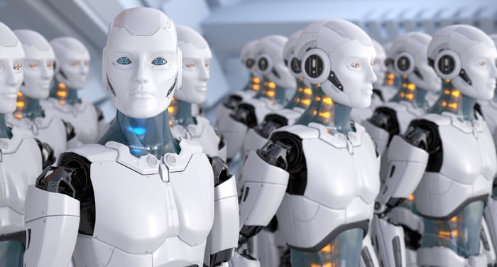 Several AI humanoid robots are lined up in rows.