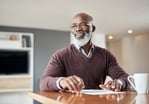 6-senior-smiling-with-bank-statements