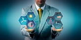 A person holding energy industry icons in their hands.