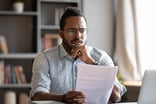 A person looking at documents