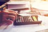 Calculator and paperwork on desk